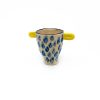 trophy shaped ceramic cup with light blue dots and light yellow handles from Rebu Ceramics