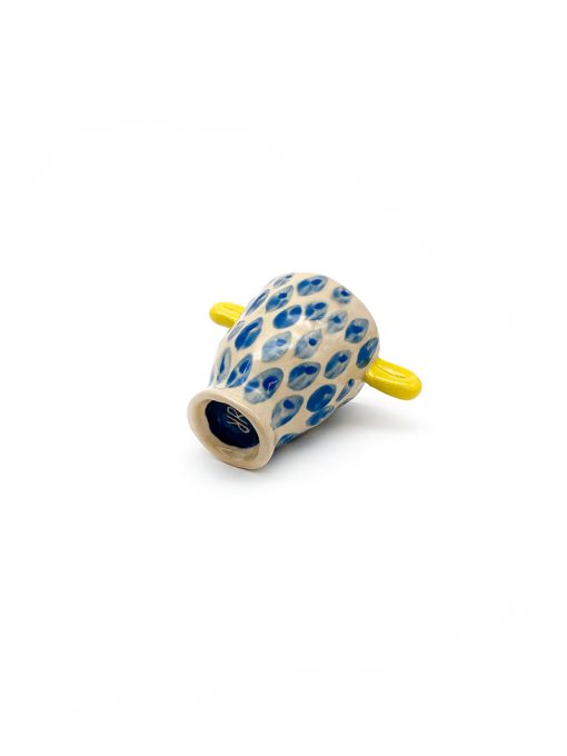 trophy shaped ceramic cup with light blue dots and light yellow handles from Rebu Ceramics