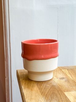 Cup with coral runny glaze.
