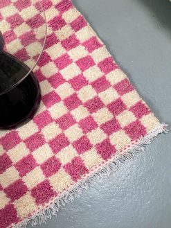 checkered rug with light purple and white checkered. The rug is hand-woven in 100% wool in Morocco.