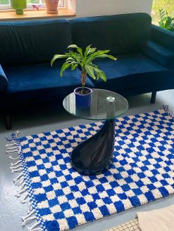 checkered rug with dark blue and white checkered. The rug is hand-woven in 100% wool in Morocco.