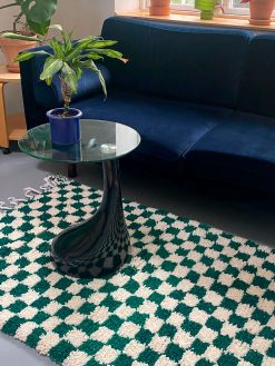 checkered rug with dark green and white checkered. The rug is hand-woven in 100% wool in Morocco.